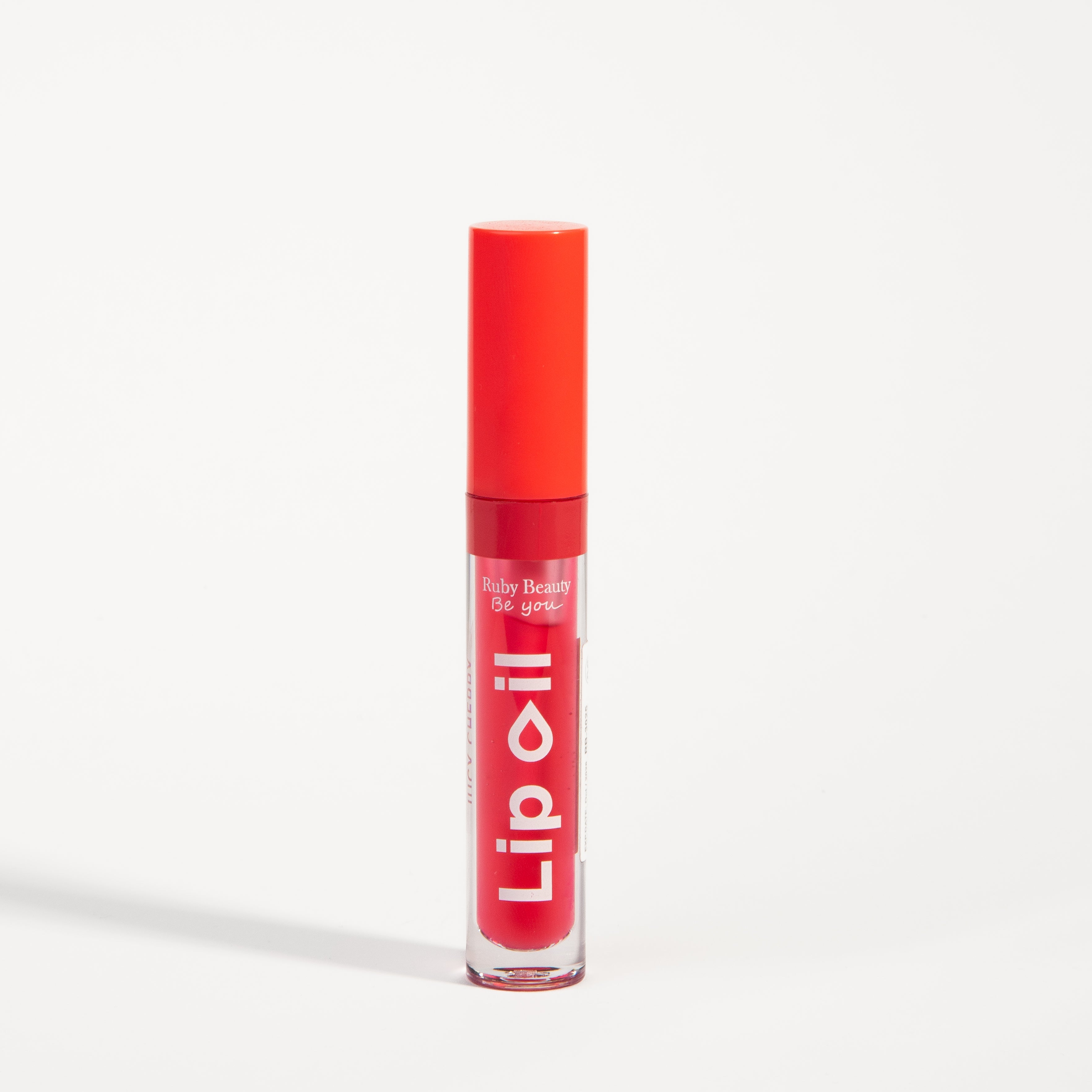 Ruby Beauty Lip Oil in Juicy Cherry β closed tube with rich red gloss