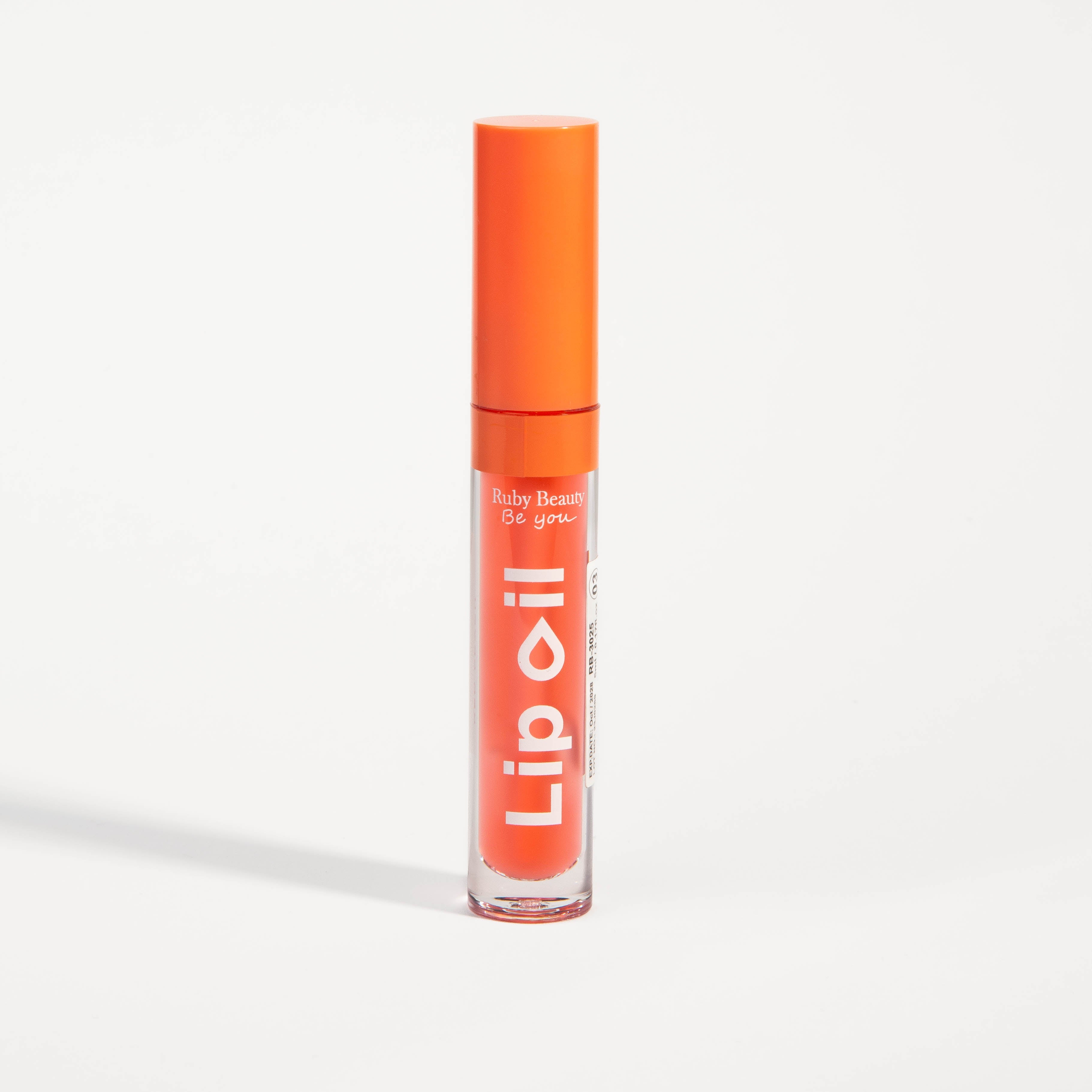 Ruby Beauty Red Peach lip oil closed tube - tinted peach lip hydration
