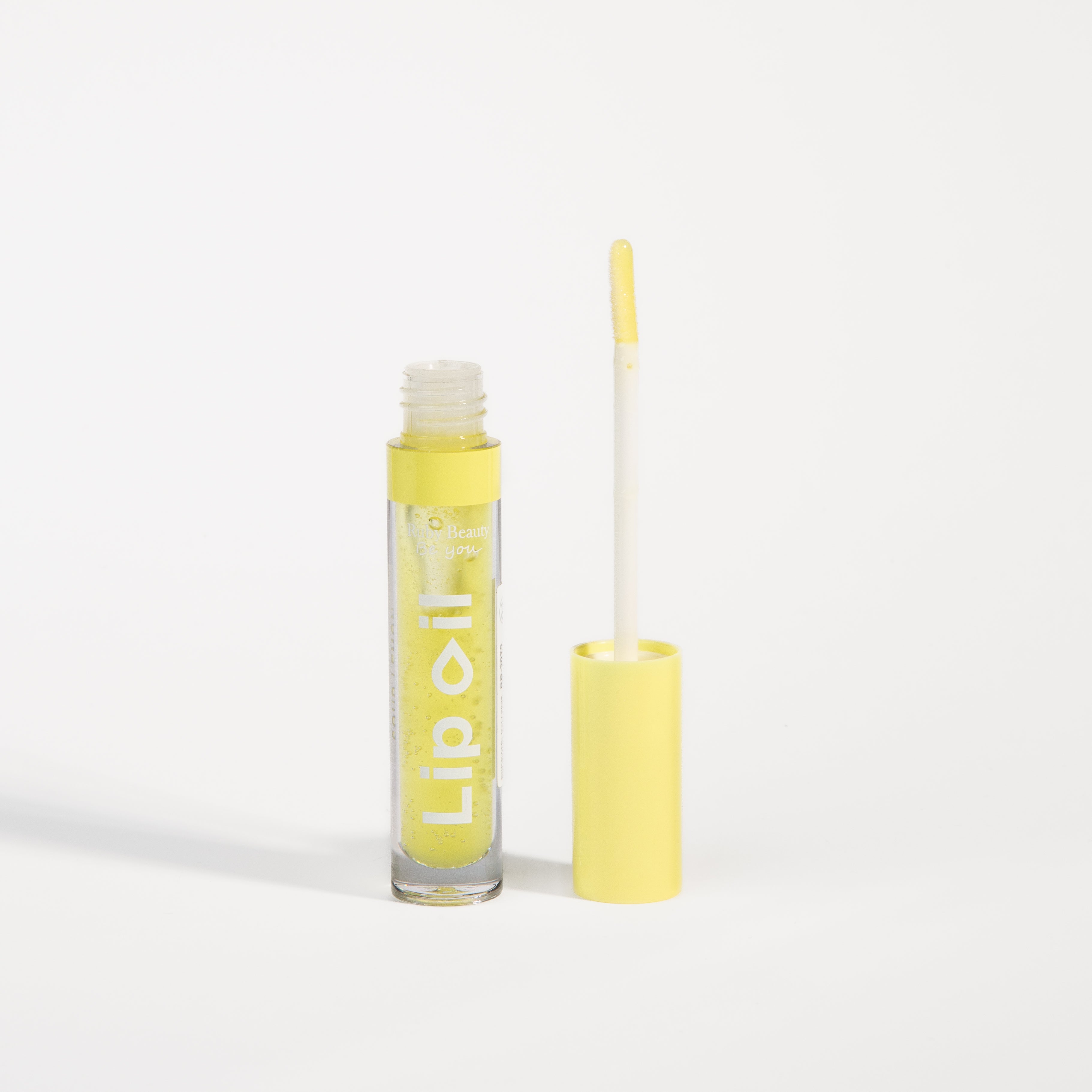 Ruby Beauty Lip Oil in Sour lemon β wand applicator showing gloss