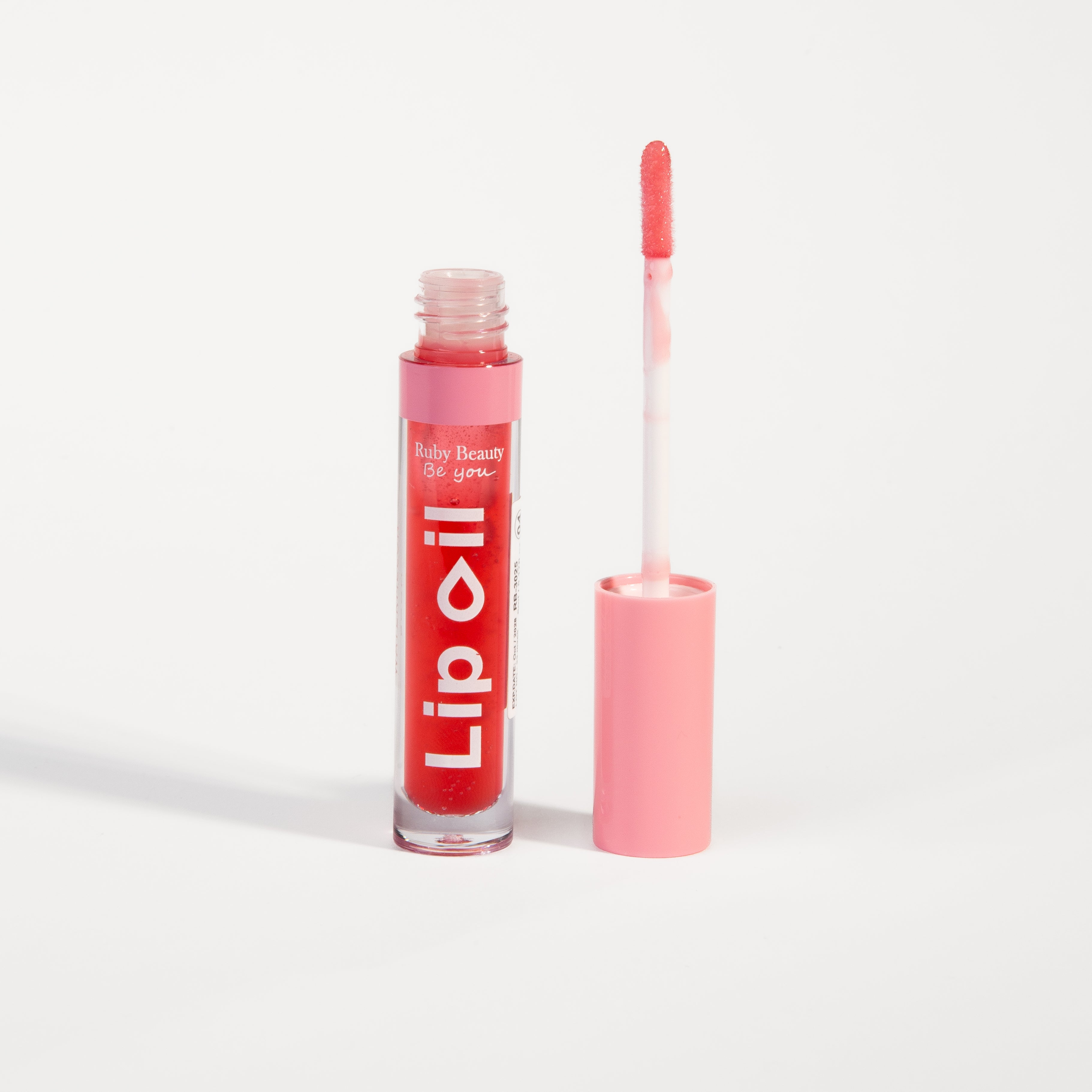 Ruby Beauty Lip Oil in Wild Strawberry β open with brush applicator