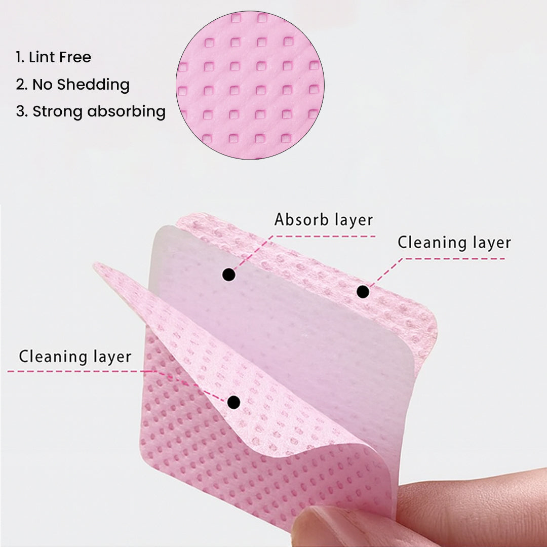 Close-up view of Ruby Beauty's pink lint-free nail wipe showing its triple-layer structure: absorb layer and dual cleaning layers.