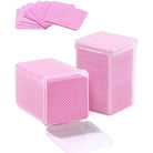 Open container of Ruby Beauty pink lint-free nail wipes, showing multiple square wipes stacked neatly.